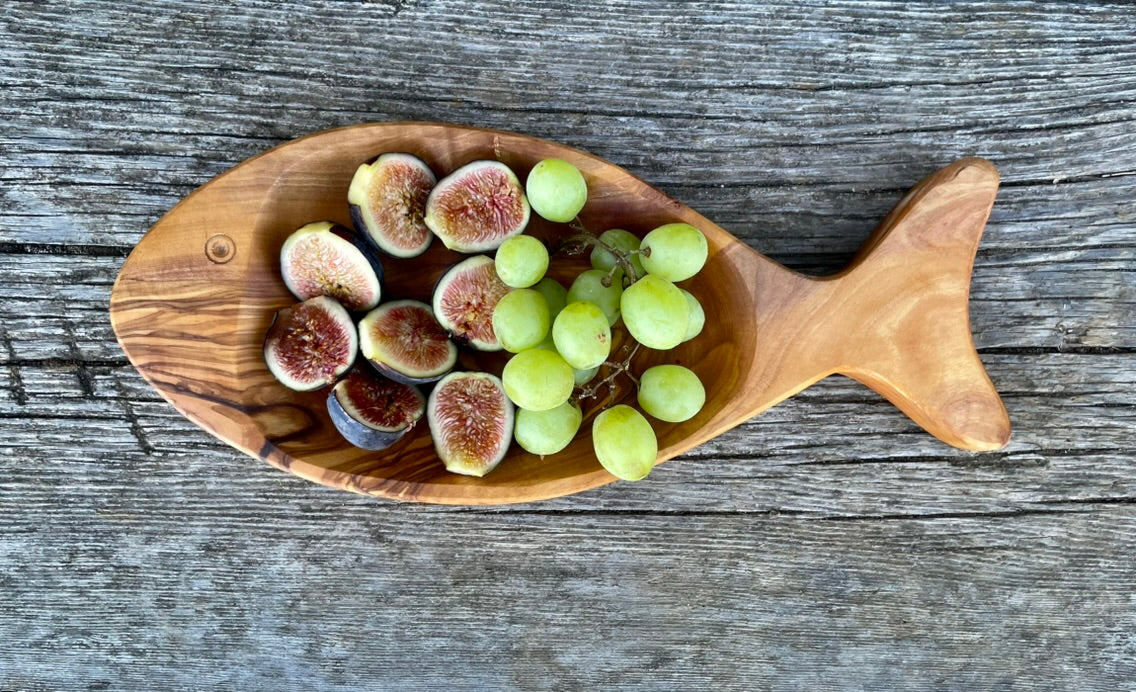 Handmade olive wood fish-shaped snack plate with figs