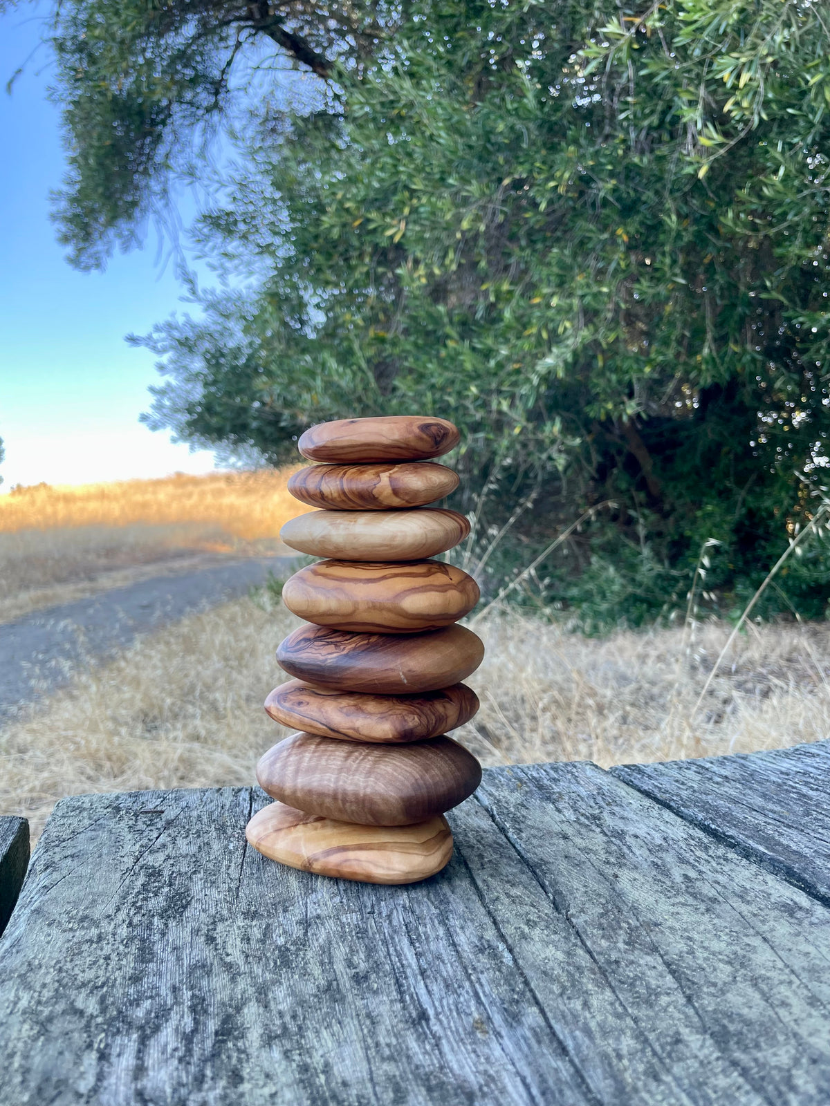 Set of eight handmade olive wood stacking stones