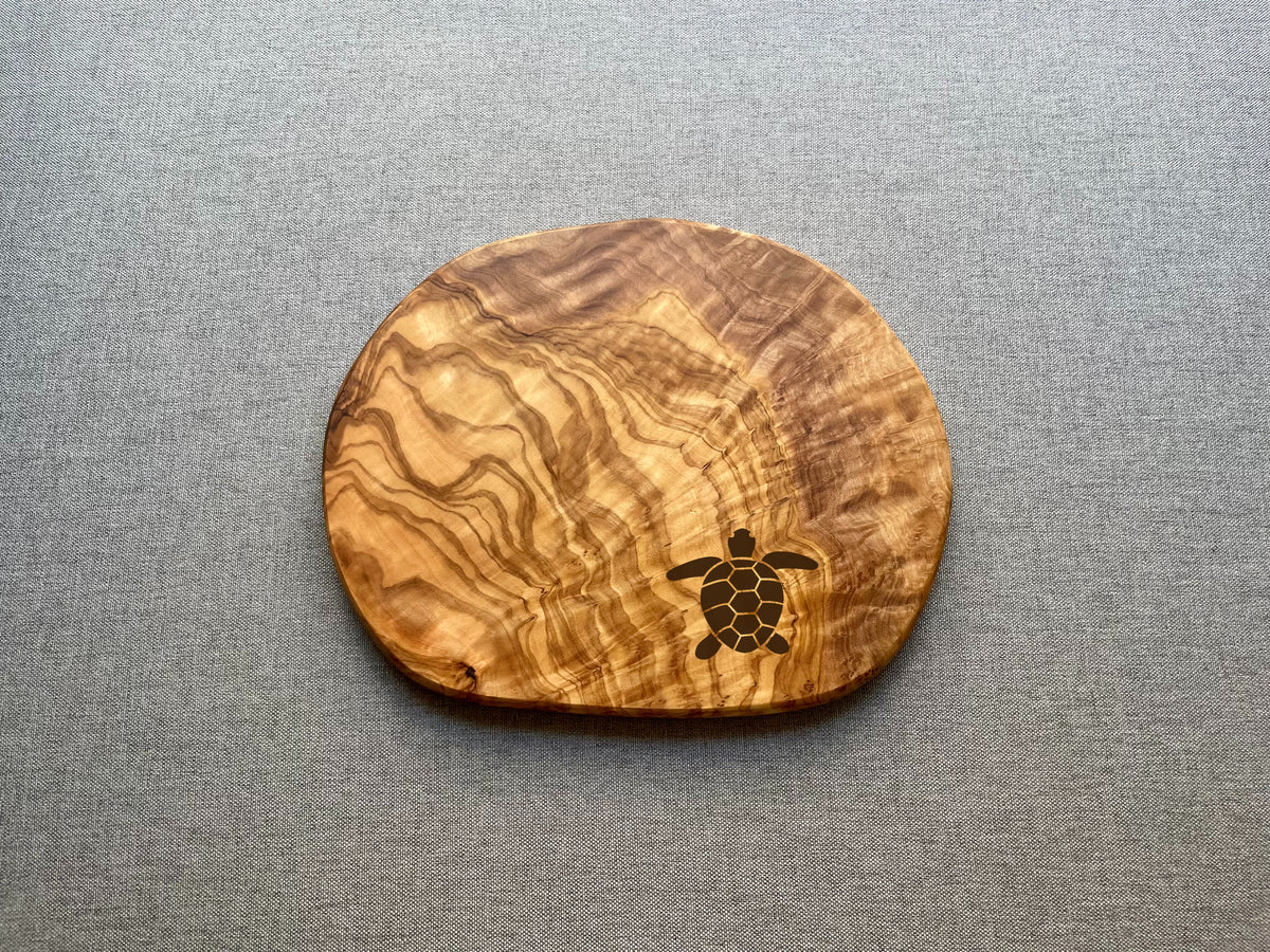 Handmade olive wood trivet with engraved icon and grain